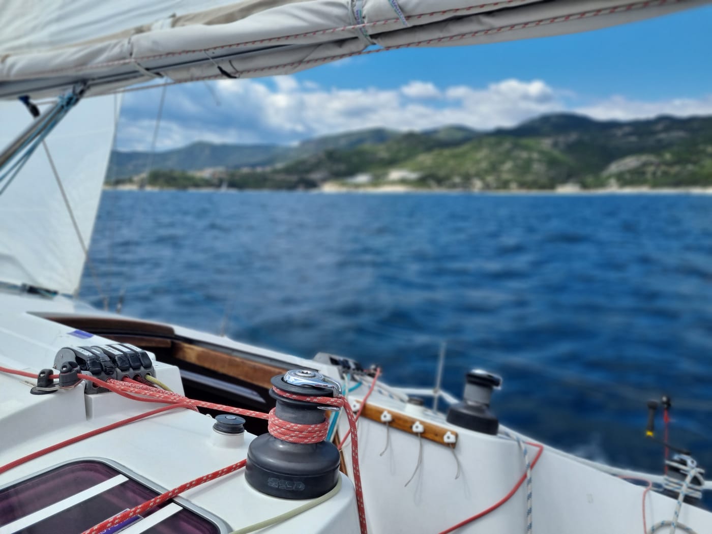 View from a sailing yacht's cockpit toward the coastline